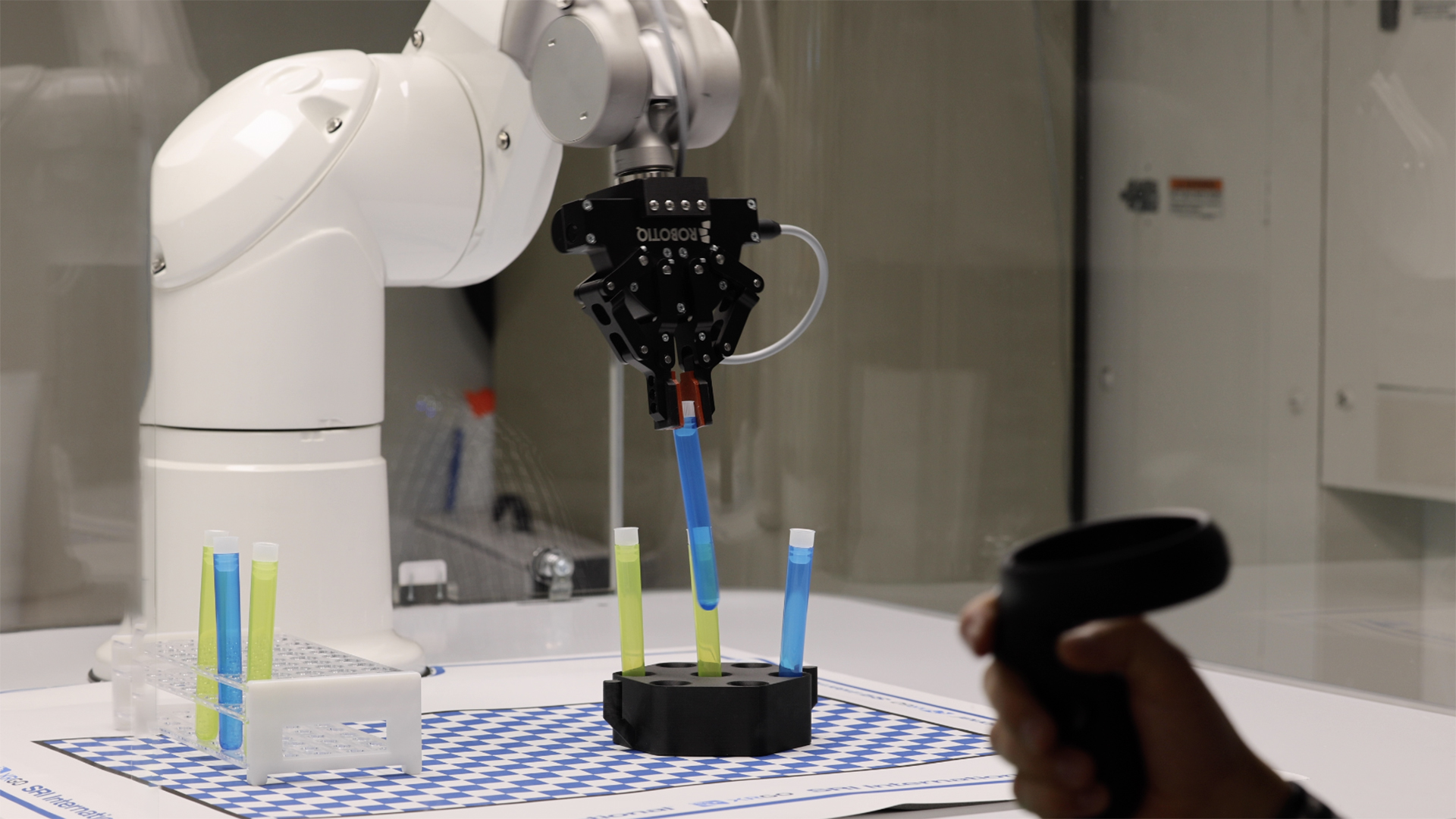 robot arm adjusting vials in cleanroom